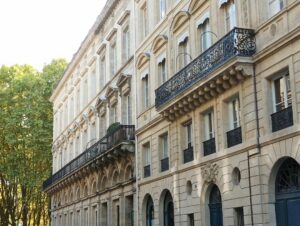 Elegant stone building with balconies and windows