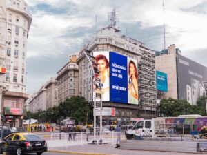 a city street with a billboard on the side of it